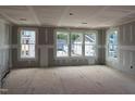 Unfinished living room featuring a spacious area with multiple windows at 303 Chesapeake Cmns St # 99, Garner, NC 27529