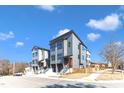 Modern townhomes showcasing contemporary design, complete with driveways, and professionally landscaped surroundings at 1000 Addison Pl # 102, Raleigh, NC 27610