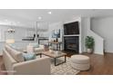 Inviting living room features a fireplace, hardwood floors, and an open floor plan at 1004 Gold Rock Ln, Morrisville, NC 27560