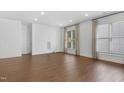 Large living area with hardwood floors and window light at 1004 Gold Rock Ln, Morrisville, NC 27560