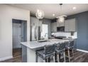 Modern kitchen with gray cabinets and quartz countertops at 283 Broomside Ave, Raleigh, NC 27603