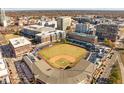 Aerial view of a baseball field surrounded by city buildings and greenery at 600 S Duke St # 26, Durham, NC 27701