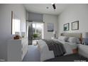 Bright bedroom with a comfortable bed, balcony access, and contemporary furnishings at 600 S Duke St # 26, Durham, NC 27701