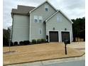 Gray sided two story house with a two car garage and landscaped yard at 503 Bendemeer Ln, Rolesville, NC 27571