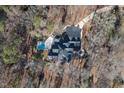 Aerial view showcasing home, pool, and wooded lot at 6701 Green Hollow Ct, Wake Forest, NC 27587