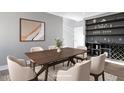 Dining room featuring a large wood table with seating and a built-in hutch for storage at 145 Ottawa Dr, Louisburg, NC 27549