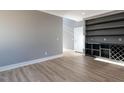 Spacious living area featuring light wood floors and a built-in hutch for storage at 145 Ottawa Dr, Louisburg, NC 27549
