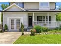 Welcoming front porch with a charming entrance and well-kept landscaping at 4708 River Boat Landing Ct, Raleigh, NC 27604