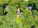 Housetop view of home surrounded by lush green trees at 1554 Middle Ridge Dr, Willow Springs, NC 27592