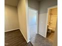 Spacious bedroom featuring neutral walls and carpeted floors, with an open bathroom and closet for easy access at 162 Vega Loop, Sanford, NC 27330