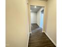 Inviting hallway boasts wood-look flooring, recessed lighting, and neutral-toned walls to make a great first impression at 162 Vega Loop, Sanford, NC 27330
