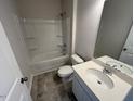 Bathroom featuring a tub/shower combo, vanity, and neutral finishes at 17 E Victory View Ter, Smithfield, NC 27577