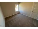 Cozy bedroom with a window and carpeted flooring at 17 E Victory View Ter, Smithfield, NC 27577