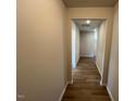 Hallway showcasing wood-look flooring leading to other rooms at 17 E Victory View Ter, Smithfield, NC 27577