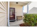 Front entrance with a bench and wreath on the door at 2019 Tennessee Rd, Durham, NC 27704