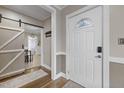 Inviting entryway with a barn door and hardwood floors at 909 E F St, Butner, NC 27509