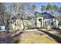 House exterior and yard with trees and a shed at 109 Springwood Dr, Wake Forest, NC 27587