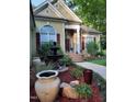 House exterior with a fountain and landscaping at 109 Springwood Dr, Wake Forest, NC 27587