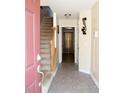 Inviting entryway with tiled floor, staircase, and access to living areas at 1235 Stone Manor Dr, Raleigh, NC 27610