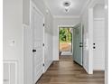 Bright entryway with light-grey walls, hardwood floors, and white doors at 1236 Dover St # 58, Roxboro, NC 27573