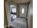 Inviting entryway featuring arched doorways, a neutral rug, and a view into the living space at 1309 Eastern Avenue Ave, Rocky Mount, NC 27801