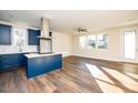 Open concept kitchen with island and stainless steel appliances at 2407 Hart Street # B, Durham, NC 27703