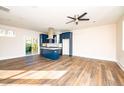 Spacious kitchen with island, stainless steel appliances, and blue cabinetry at 2407 Hart Street # B, Durham, NC 27703