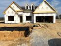 A house under construction reveals an unfinished exterior at 260 Olivia Crossing Ct # 9, Four Oaks, NC 27524