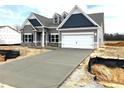 Charming single-Gathering home with an attached two-car garage and a beautifully designed modern exterior at 260 Olivia Crossing Ct # 9, Four Oaks, NC 27524