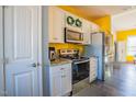 White cabinets, granite countertops, and stainless steel appliances at 58 Northview Dr, Middlesex, NC 27557