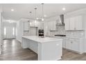 Beautiful kitchen with a large island, stainless steel appliances, and ample counter space at 60 Accord Dr, Youngsville, NC 27596