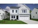 Two-story house, white siding, gray roof, and black garage door at 75 Calabria Ct, Franklinton, NC 27525