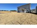 Home's backyard features a large grassy area and a screened porch at 100 S Stonemill Trl # Homesite 234, Clayton, NC 27520
