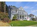 Gray two-story house with a landscaped yard and porch at 106 Skygrove Dr, Clayton, NC 27527