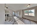 Living room with stairs, carpet, and large window at 15 Michael Ct, Erwin, NC 28339