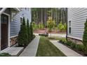 Landscaped walkway between townhomes leading to street at 2024 Chipley Dr, Cary, NC 27519