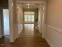 Inviting hallway features hardwood floors and opens to a bright, airy living space with lots of windows at 292 Weddington Way, Benson, NC 27504