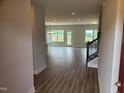 Inviting living area featuring wood floors, ample natural light, and an open layout at 308 Whispering Way, Sanford, NC 27330