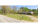 Ranch house with a long driveway and mailbox at 3600 Nc 561, Louisburg, NC 27549