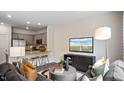 Open living space with kitchen island and comfortable seating at 448 Belgian Red Way, Wake Forest, NC 27587