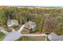 Bird's-eye view of house and cul-de-sac neighborhood at 5040 Darcy Woods Ln, Fuquay Varina, NC 27526