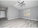 Bright living room featuring gray walls and vinyl flooring at 801 Thornberry Ct, Spring Hope, NC 27882