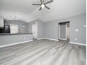Open concept living room and kitchen with gray walls at 801 Thornberry Ct, Spring Hope, NC 27882