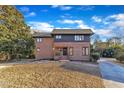 Inviting two-story home featuring a brick exterior at 126 Person St, Louisburg, NC 27549
