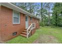 Brick side elevation showing a back door and steps at 1558 Harper St, Rocky Mount, NC 27801