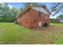 Rear view of brick home showcasing the back yard at 1558 Harper St, Rocky Mount, NC 27801