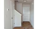 Entryway featuring white walls and doors, with a staircase leading to the upper level at 204 S Beaumont Ave, Burlington, NC 27217