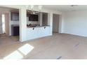 Open-concept living room with kitchen view featuring recessed lighting and natural light at 204 S Beaumont Ave, Burlington, NC 27217