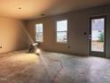 Spacious living room with large windows and unfinished walls at 204 S Beaumont Ave, Burlington, NC 27217