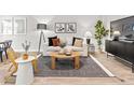 Living room with comfy sofa, coffee table, and stylish decor at 225 Starlight St, Sanford, NC 27330